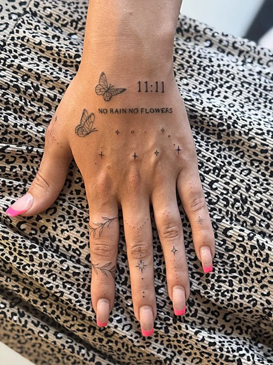 Small Fine Line Butterflies and Numbers on Women Fingers Tattoo by @inkhancedbynicole