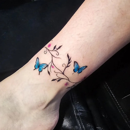 Small Fine Line Butterflies and Vines on Women Ankle Tattoo by @goth_tattoo
