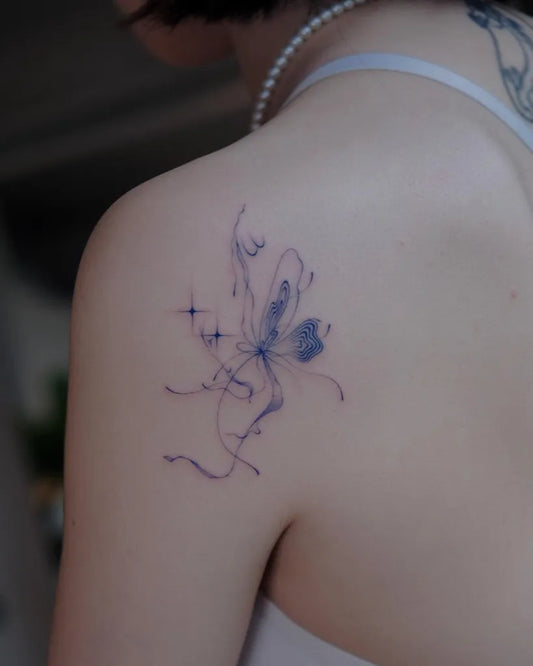 Small Fine Line Butterfly Tattoo on Women Shoulder by @ninostitches