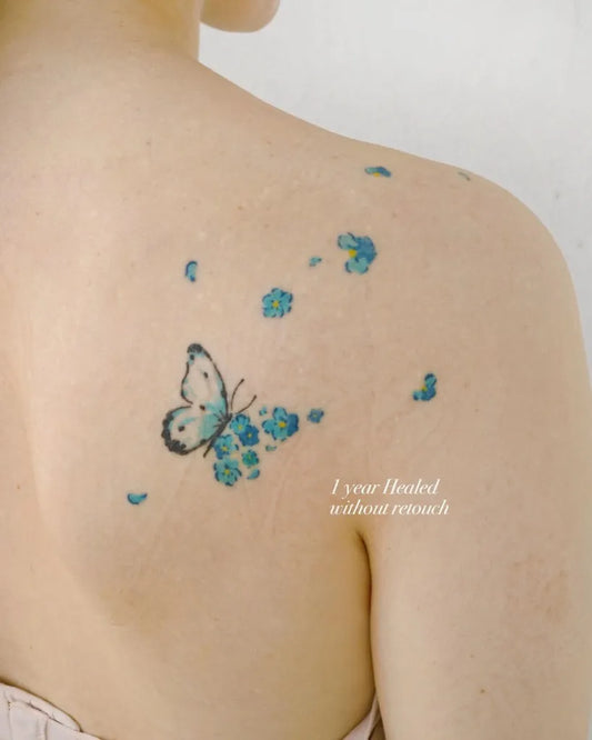 Small Fine Line Butterfly and Flowers Tattoo on Women Shoulder by @aroha_tattoo