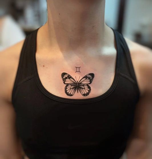 Small Fine Line Butterfly and Roman Numerals on Women Chest Tattoo by @_inkspell