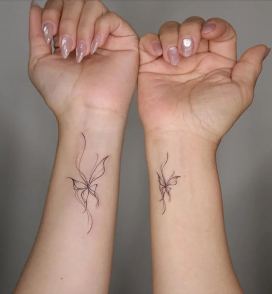 Small Fine Line Butterfly on Couple Wrists Matching Tattoo by @soomool.tt