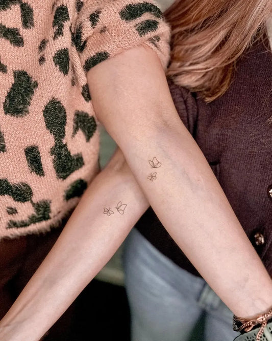 Small Fine Line Butterfly on Women Arm Tattoo by @helenedovasink