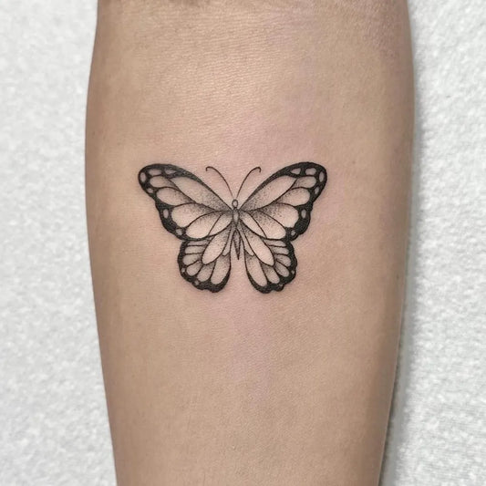 Small Fine Line Butterfly on Women Forearm Tattoo by @oldlondonroadtattoos