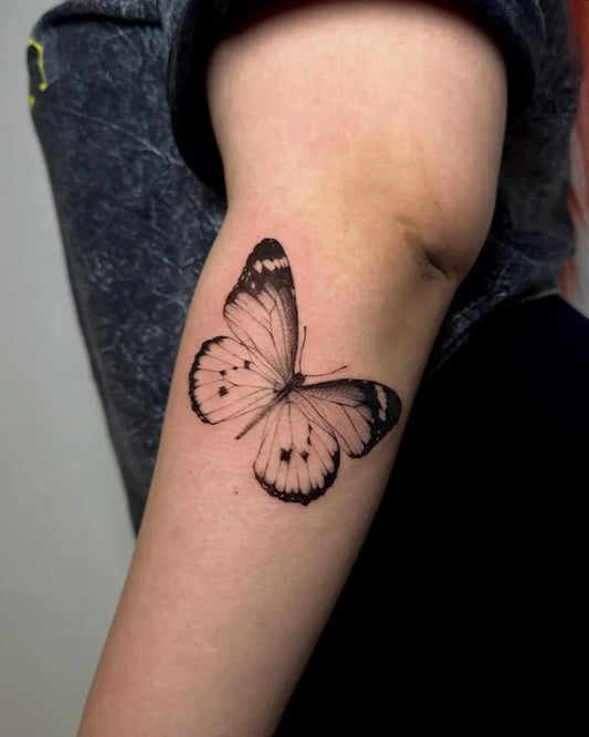 Small Fine Line Butterfly on Women Upper Arm Tattoo by @amberproject.ph