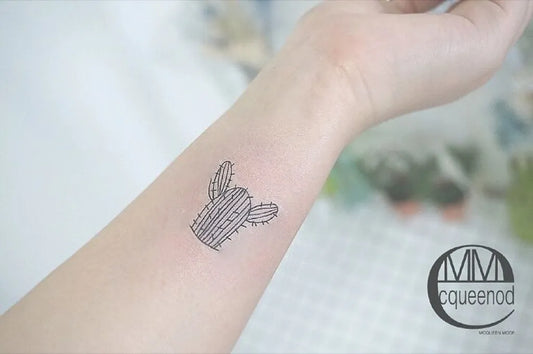 Small Fine Line Cactus Tattoo on Women Wrist by @mcqueen_mode