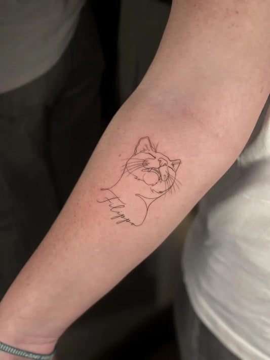 Small Fine Line Cat Tattoo on Women Forearm by @j.j.tattoo