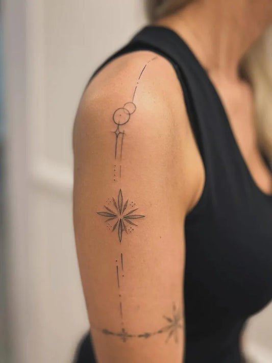 Small Fine Line Celestial Chains and Stars on Women Shoulder Tattoo by @mandala.ink