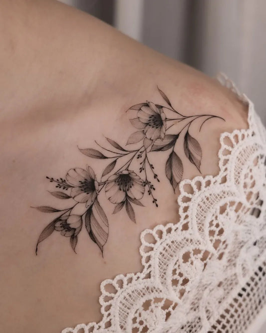 Small Fine Line Cherry Blossom Branch on Women Shoulder Tattoo by @black.peony.ink