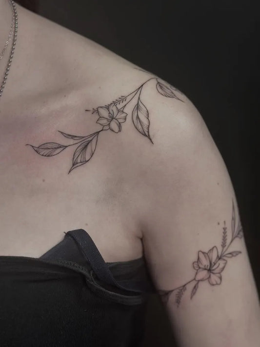 Small Fine Line Cherry Blossom Branch on Women Shoulder Tattoo by @mads_inks
