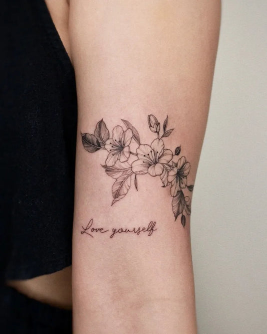 Small Fine Line Cherry Blossom Love Yourself Text on Women Arm Tattoo by @yulight_tattoo