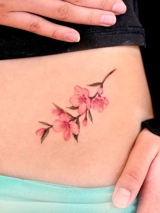Small Fine Line Cherry Blossom on Women Hip Tattoo by @tattooist_gaon