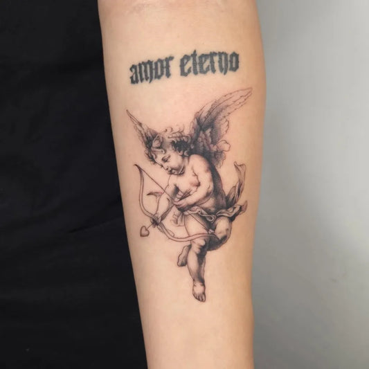 Small Fine Line Cherub Arrow AmorEterno Tattoo on Women Arm by @ashynuckles