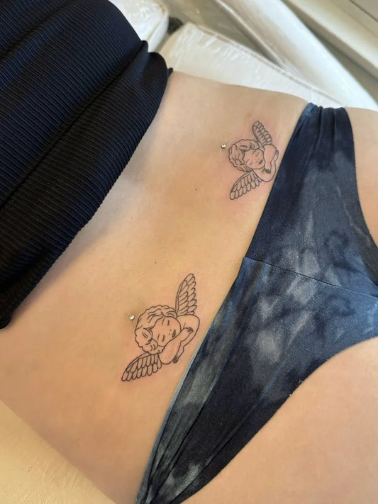 Small Fine Line Cherub Tattoo on Women Hip by @sdtinytattoos