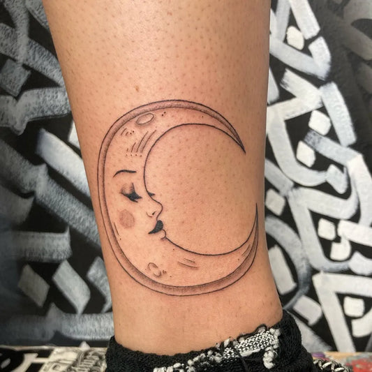 Small Fine Line Crescent Moon Face Tattoo on Women Ankle by @marzzcreatez