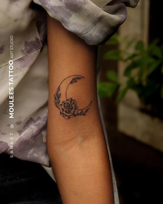 Small Fine Line Crescent Moon and Rose Tattoo on Women Arm by @moulees_tattoo_art