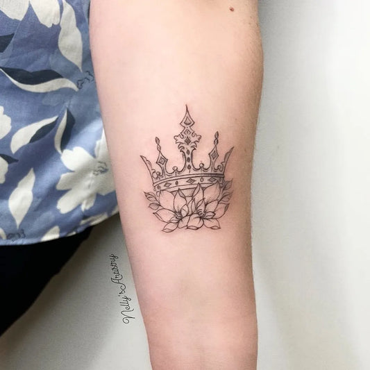 Small Fine Line Crown and Lotus Tattoo on Women Arm by @nellys_artistry_tattoo_pmu