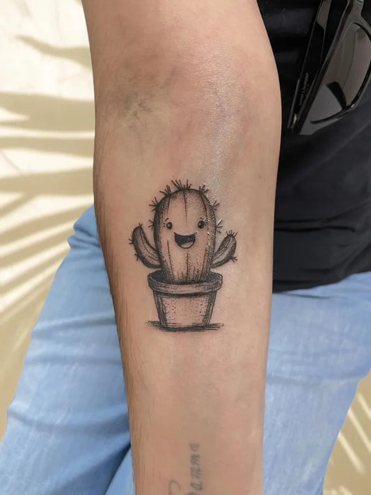 Small Fine Line Cute Cactus in Pot Tattoo on Women Arm by @inkwave.tattoo.fuerteventura