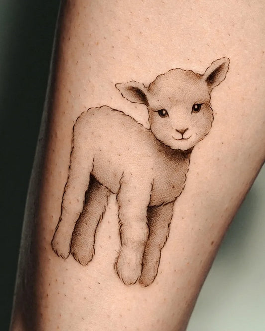 Small Fine Line Cute Lamb Animal Tattoo on Women Leg by @gingiepop