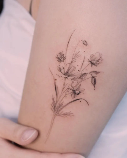 Small Fine Line Daffodil Bunch Tattoo on Women Thigh by @tattooist_hea