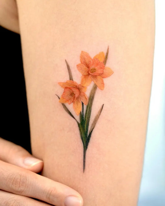 Small Fine Line Daffodil Flowers Tattoo on Women Arm by @tattooist_gaon