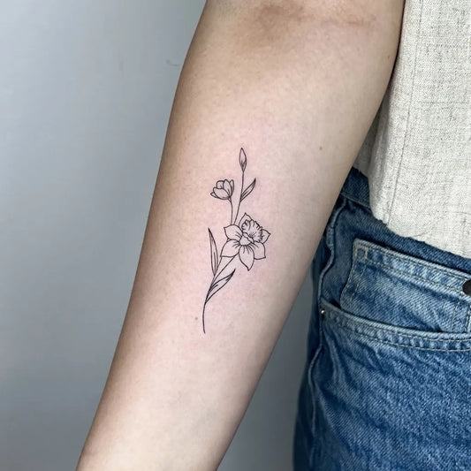 Small Fine Line Daffodil and Buds Tattoo on Women Arm by @butter_tattoos