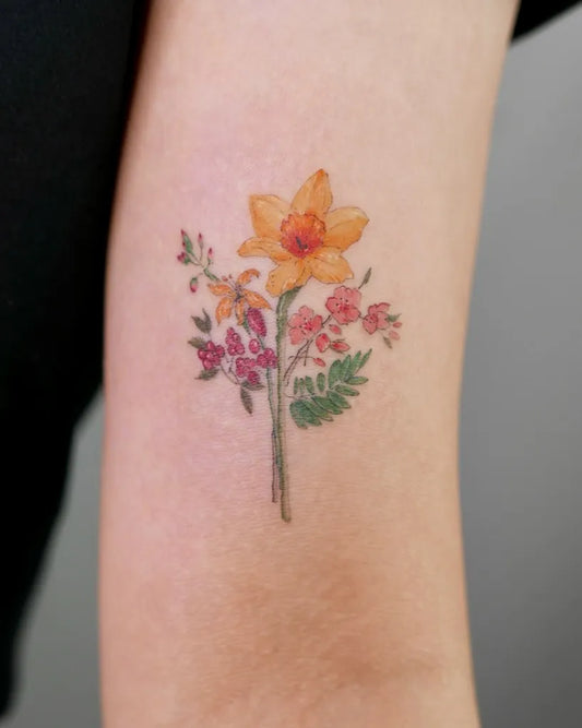 Small Fine Line Daffodil and Pink Flowers Tattoo on Women Arm by @ihwatattoo