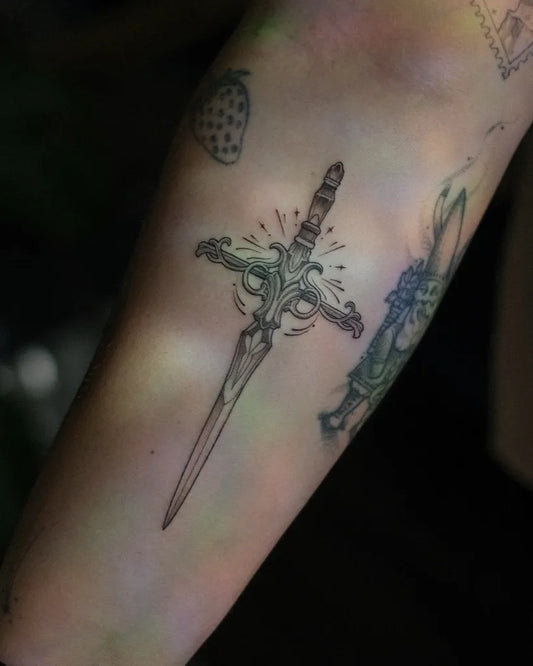 Small Fine Line Dagger and Sword Tattoo on Women Arm by @mellow_fluffs
