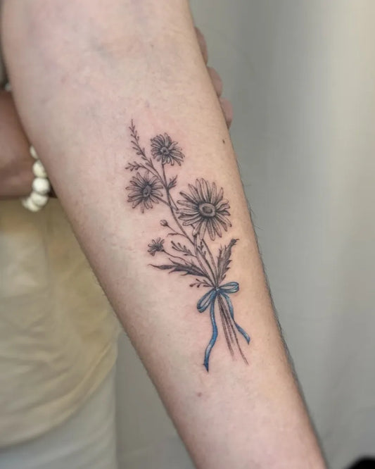 Small Fine Line Daisy Bouquet Tattoo on Women Arm by @saikaa.tattoos
