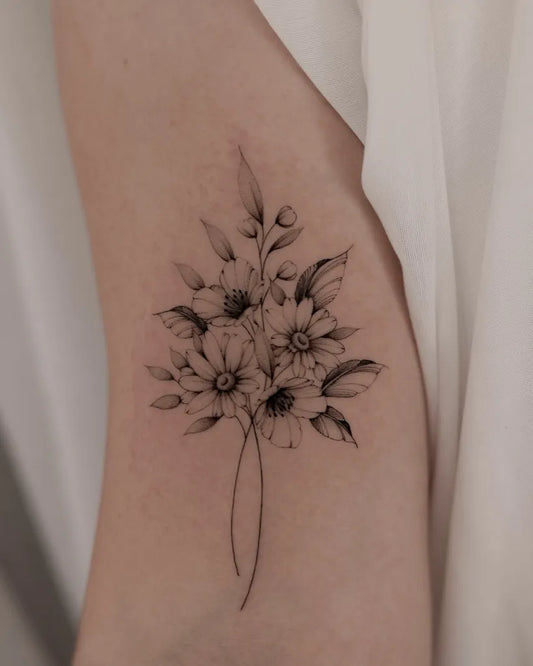 Small Fine Line Daisy Flowers Tattoo on Women Arm by @black.peony.ink