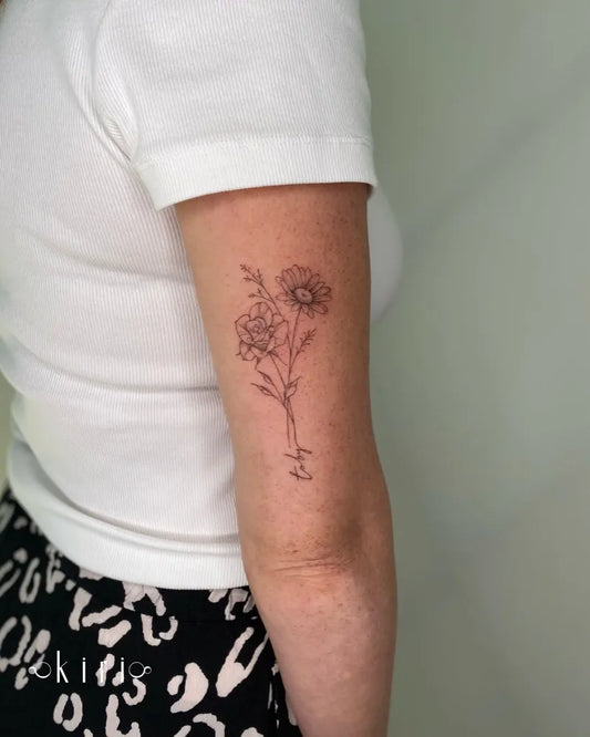 Small Fine Line Daisy Flowers Tattoo on Women Arm by @kiri.vrs