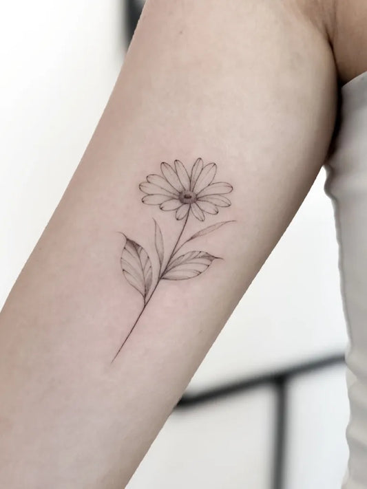 Small Fine Line Daisy Tattoo on Women Arm by @christinas.ink