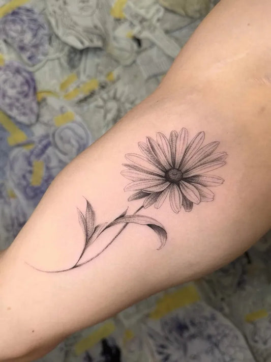 Small Fine Line Daisy Tattoo on Women Arm by @tat.to_tira