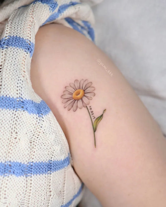 Small Fine Line Daisy Tattoo on Women Shoulder by @gami_ttt