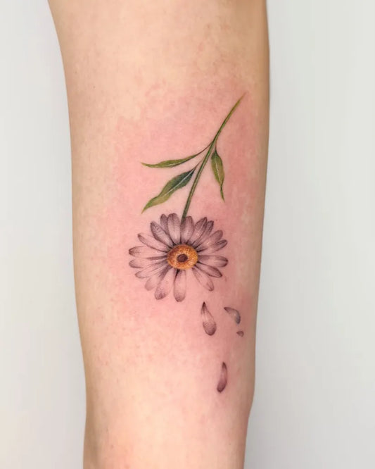 Small Fine Line Daisy with Petals Women Arm by @peria_tattoo