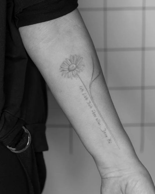 Small Fine Line Daisy with Quote Tattoo on Women Forearm by @bymosler
