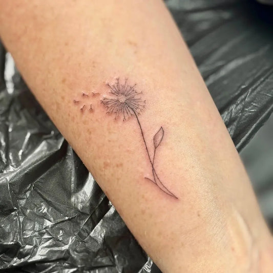 Small Fine Line Dandelion Tattoo on Women Arm by @harlowesbeauty