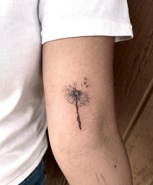 Small Fine Line Dandelion Tattoo on Women Arm by @tattedbytaya