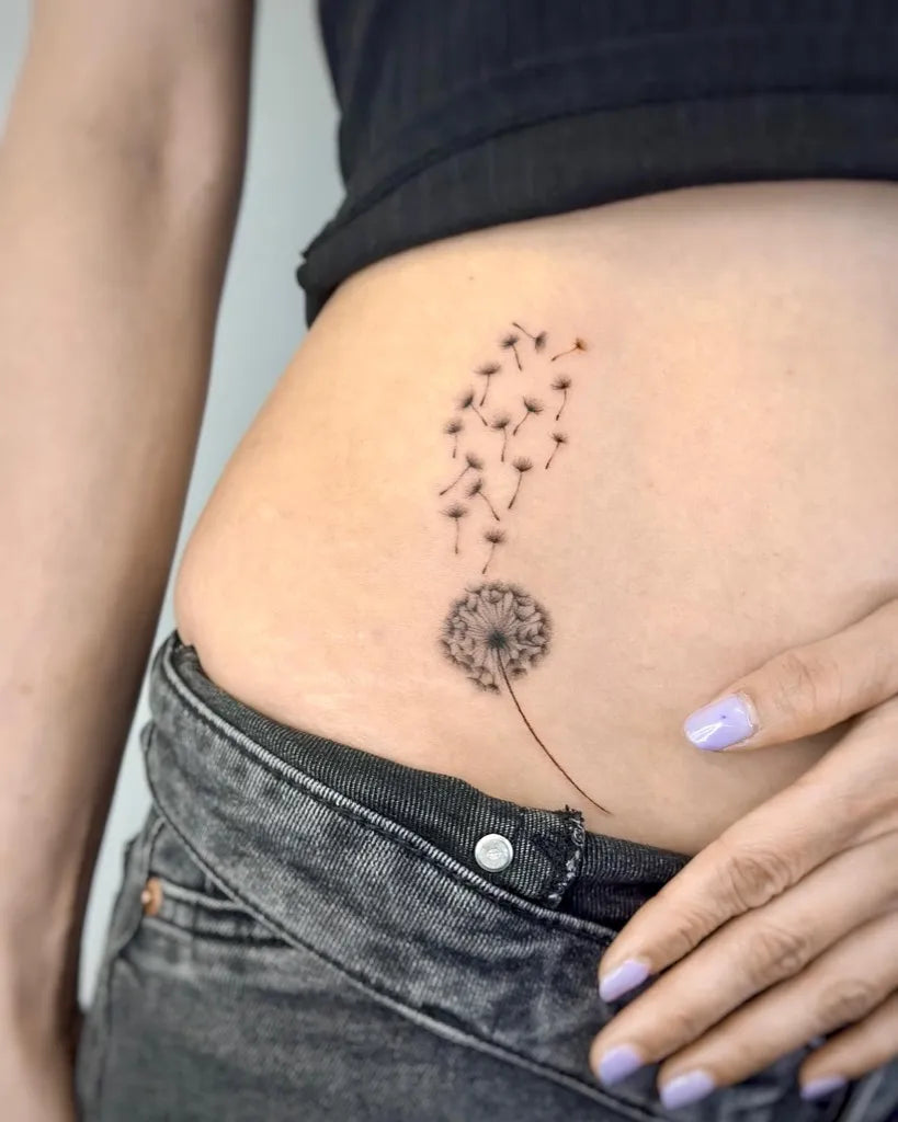 Small Fine Line Dandelion Tattoo on Women Hip by @kentip_789tattoo