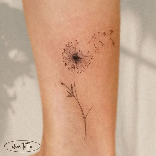 Small Fine Line Dandelion Tattoo on Women Leg by @choa._.tattoo