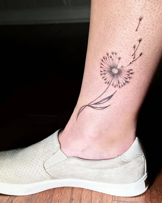Small Fine Line Dandelion Tattoo on Women Leg by @tattoohusky