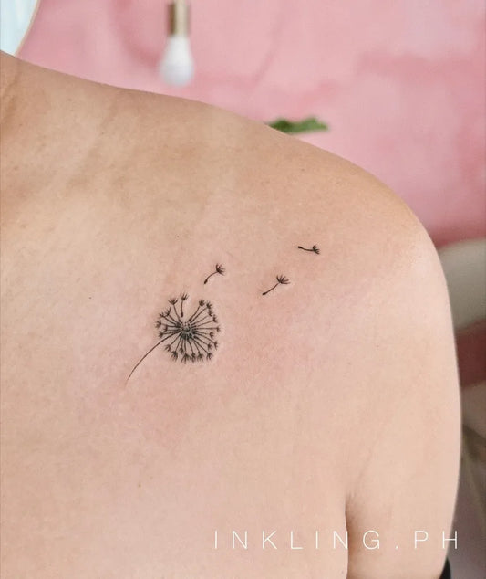 Small Fine Line Dandelion Tattoo on Women Shoulder by @inkling.ph