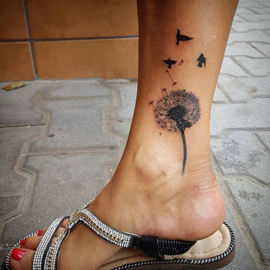 Small Fine Line Dandelion and Birds Tattoo on Women Leg by @polar_art
