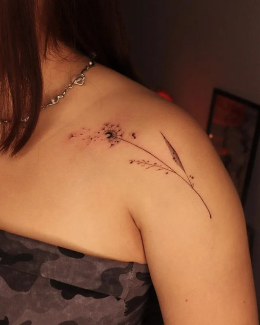 Small Fine Line Dandelion and Grass Tattoo on Women Shoulder by @shudrawsthings