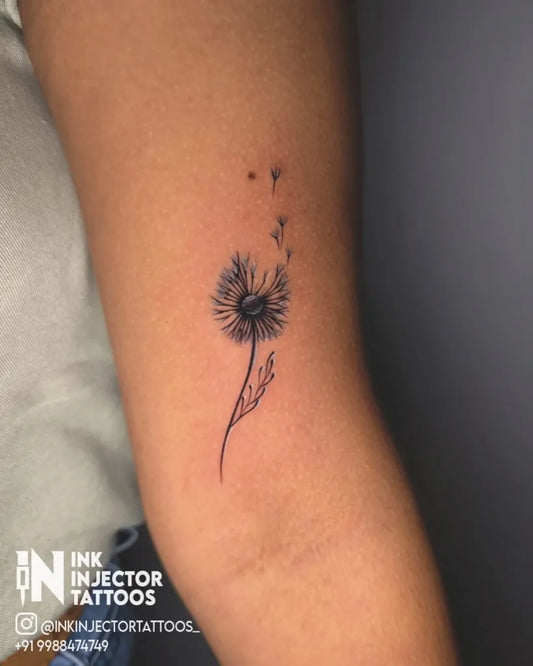 Small Fine Line Dandelion and Seeds Tattoo on Women Arm by @inkinjectortattoos_