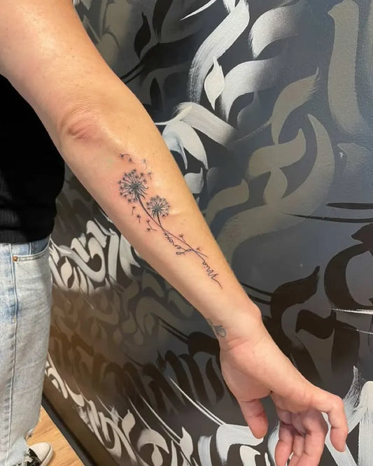 Small Fine Line Dandelion and Wish Tattoo on Women Arm by @lakeedentattoo