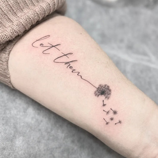 Small Fine Line Dandelion with Let Them on Women Arm Tattoo by @inkdbybrownz_fineline_tattoo