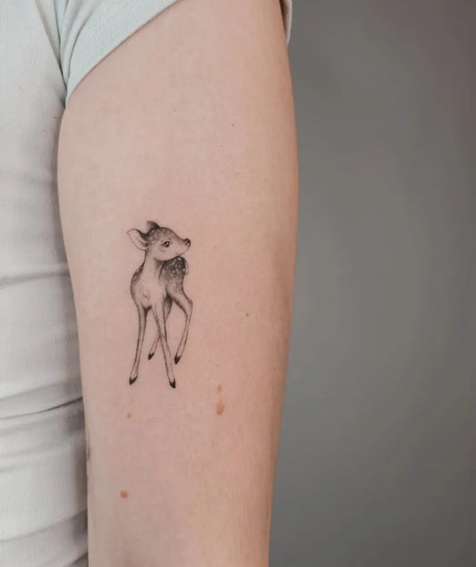 Small Fine Line Deer Tattoo on Women Arm by @tattoosby_elise
