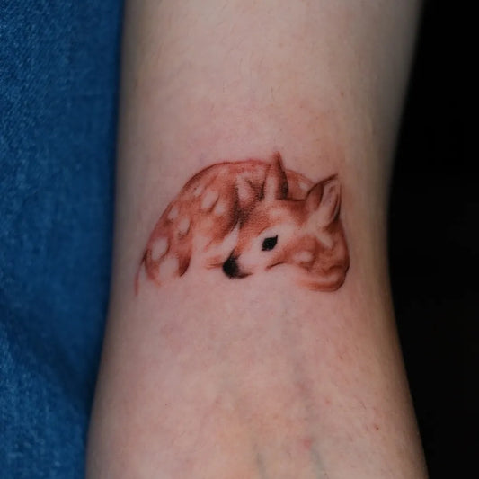 Small Fine Line Deer Tattoo on Women Arm by @tatubunn