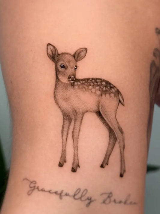 Small Fine Line Deer and Script Tattoo on Women Arm by @tattoosbycarol